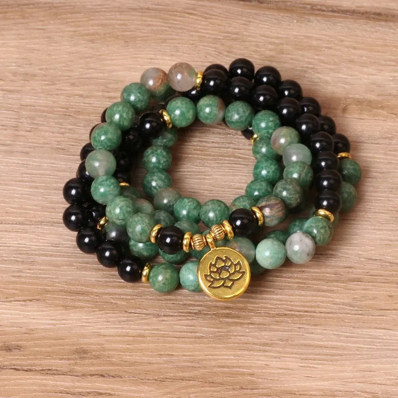 Green and black alloy elastic beaded long bracelet showing stretch design and personality-themed elements