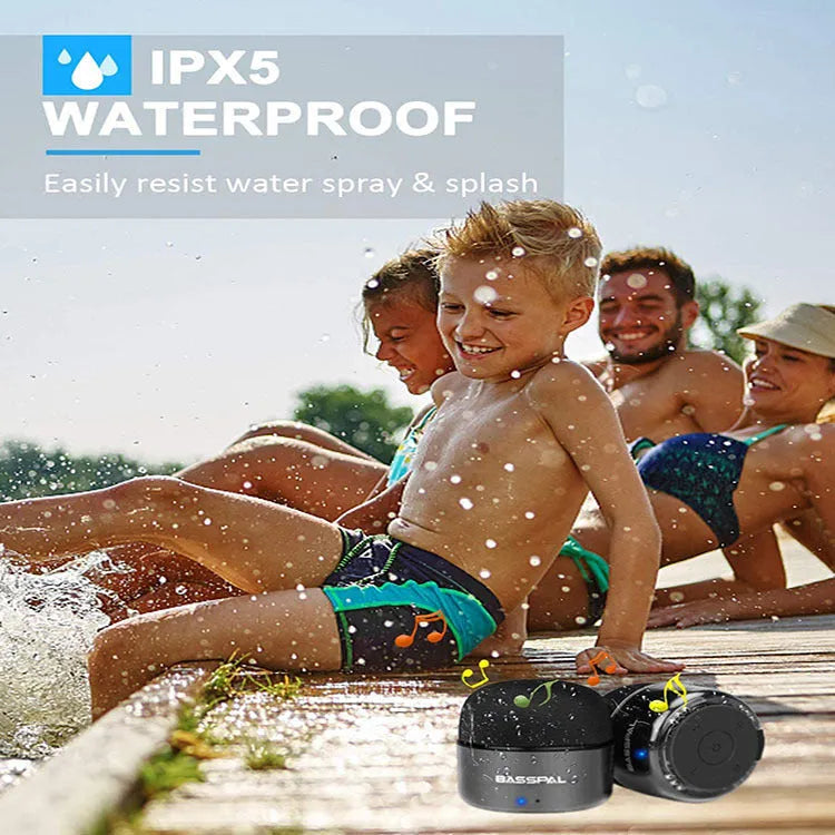Black portable mini Bluetooth speaker showing waterproof design and control buttons