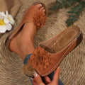 Women's dark brown peep-toe slippers with a thick rubber sole and fish mouth design on a white background.