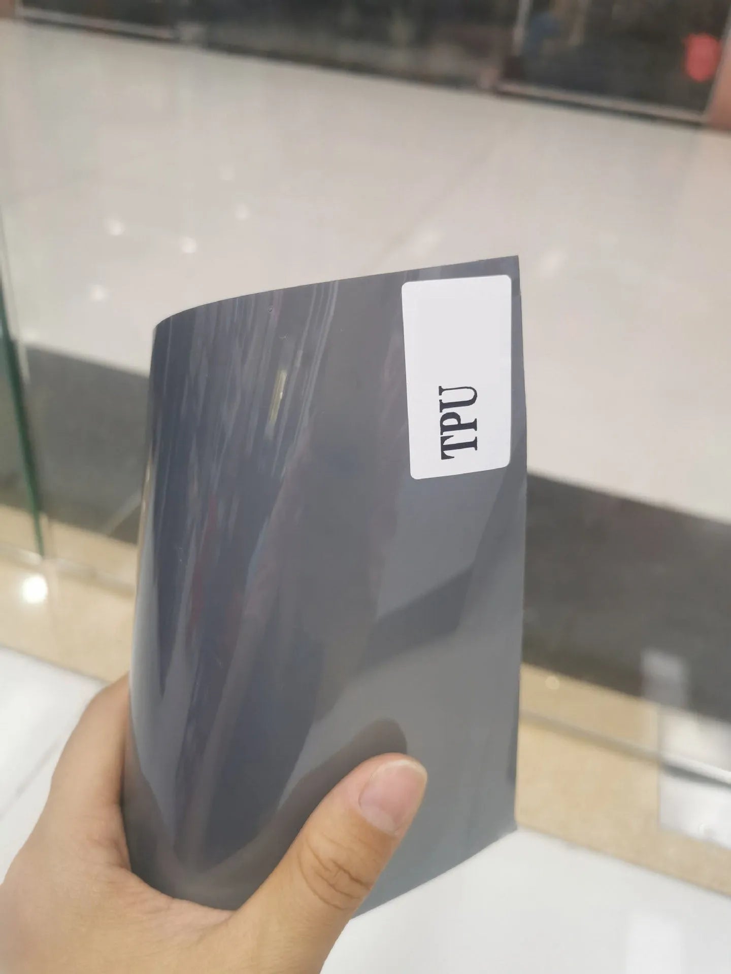 Roll of 30cm wide protective film for large LED car lampshades, showing PVC and TPU material options.