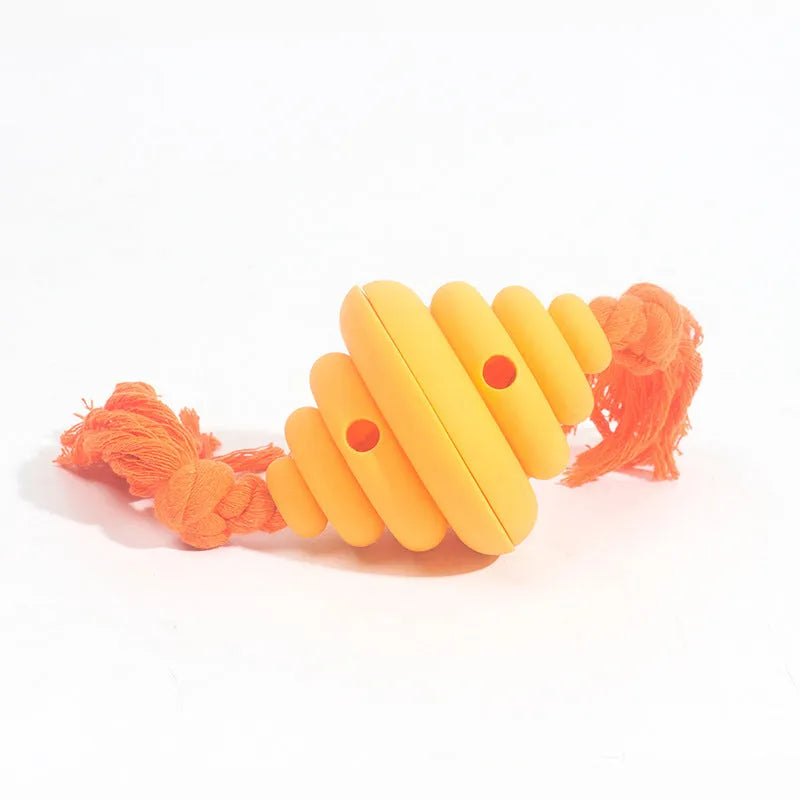 Green and yellow silicone dog ball with knotted rope, a treat-dispensing toy for large dogs.