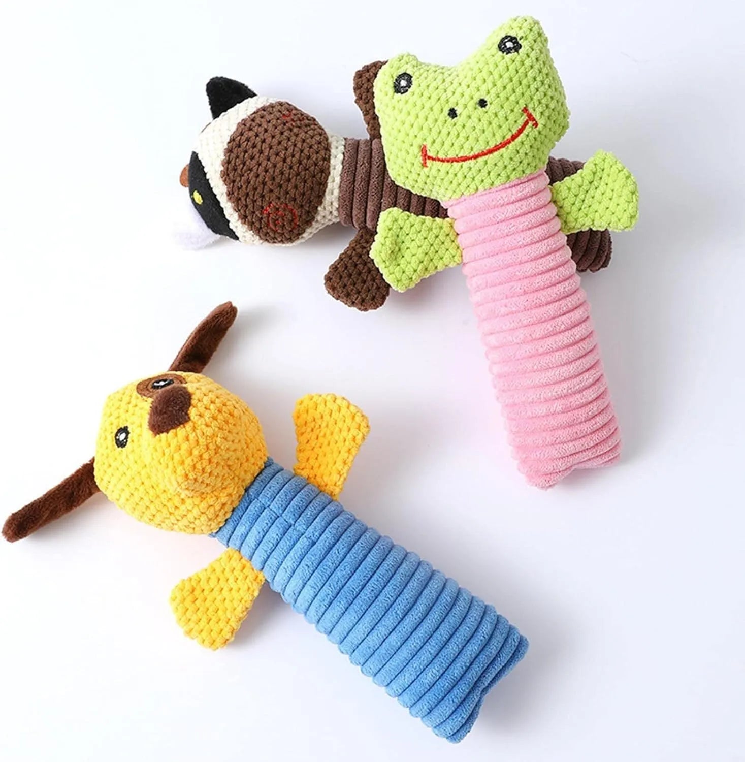 Squeaky stuffed animal dog chew toy for dental care, shown in calf, frog, or puppy design.
