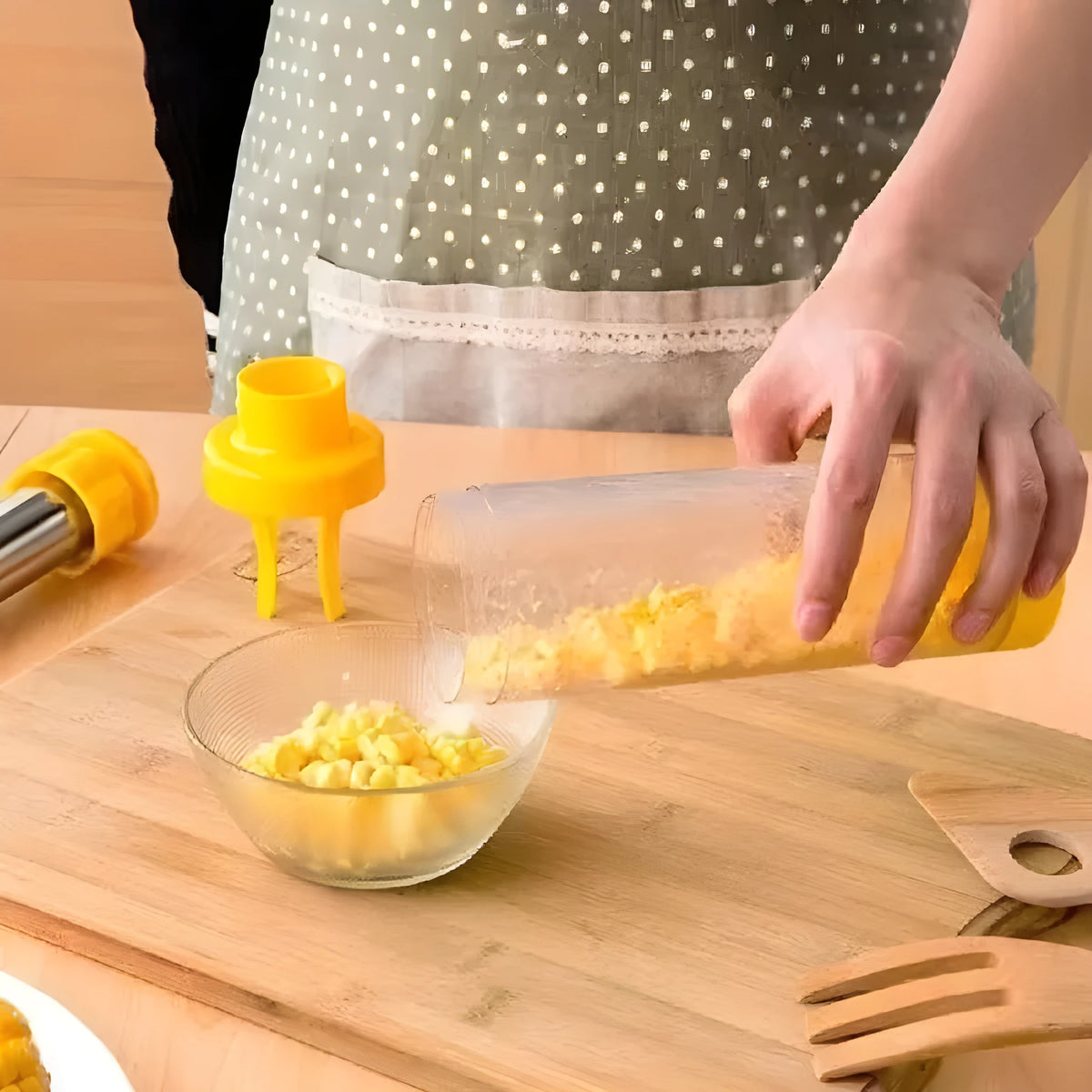 Yellow corn stripper tool with cylindrical design measuring 27cm high with stainless steel components