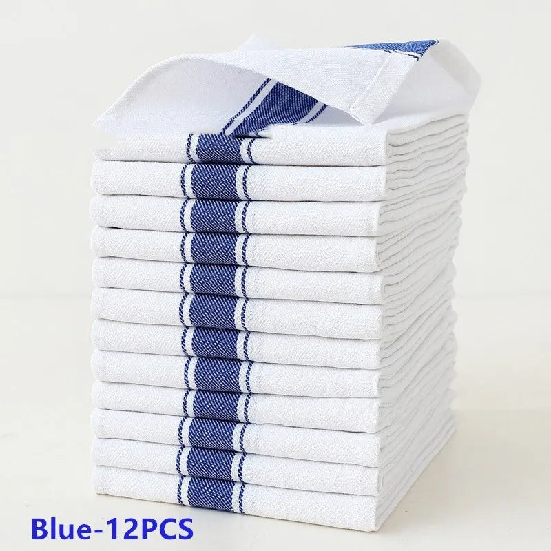 Set of 12 striped cotton dish towels in mixed colours including black, blue, brown, yellow on a kitchen surface