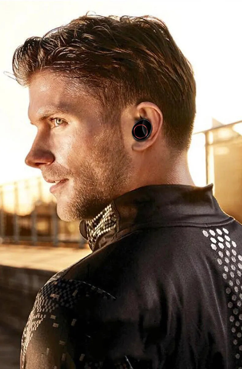 Black X11 wireless Bluetooth earbuds with charging case and six silicone ear sleeves on a white background.