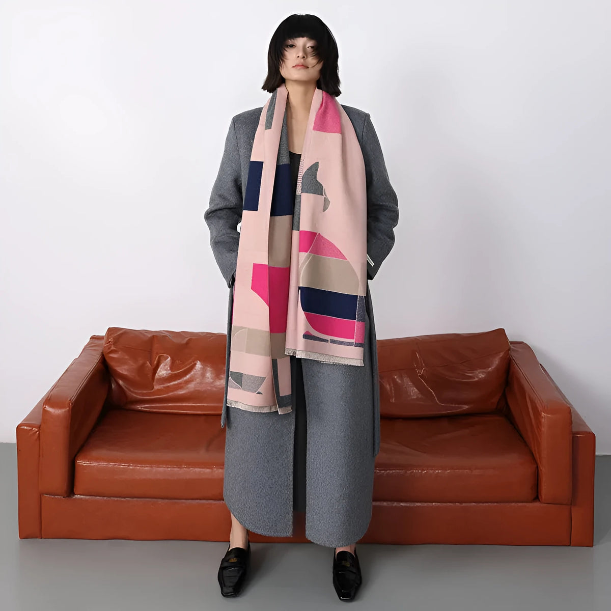 A long beige imitation cashmere scarf draped to show its 185cm length and texture.