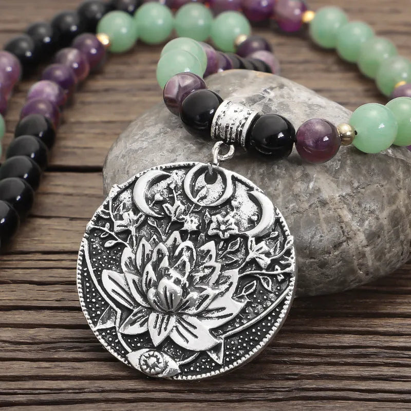 Dongling Long handmade stone bead necklace with alloy lotus pendant and matching bracelet.