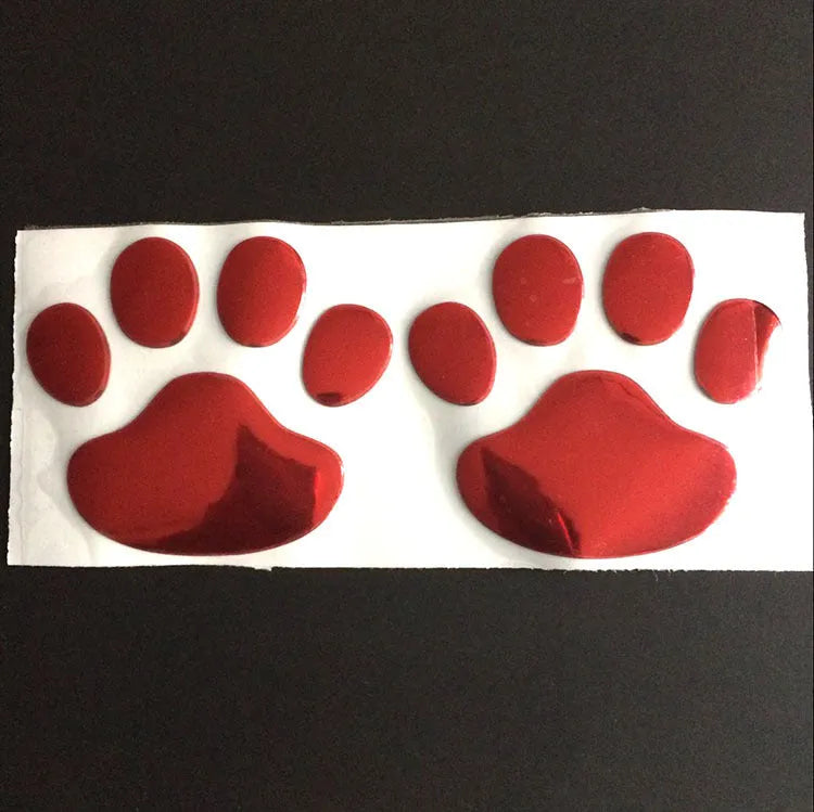 Hand-shaped brush outline car sticker with dog footprints, shown in black colour, measuring 7cm long.