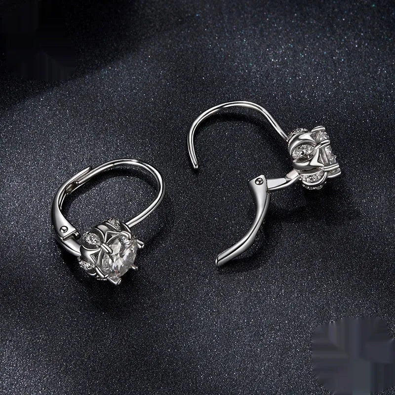 Sterling silver flower bud clip-on earrings with 0.5 carat moissanite centrepiece and white gold plating