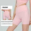 Women's leaf green high waist Lycra yoga shorts with four-point construction on a fitness background.