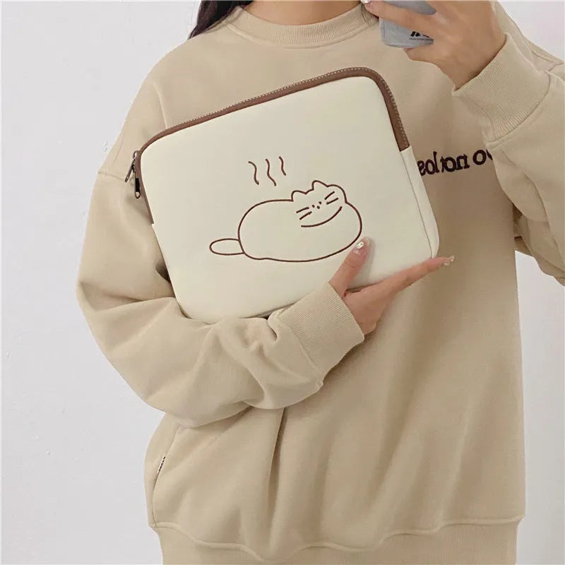 Animal embroidered tablet protective sleeve in nylon with zip opening showing size comparison