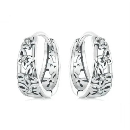 Retro hollow butterfly stud earrings in sterling silver with zircon accents, 14mm by 5mm.