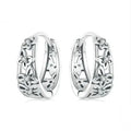 Retro hollow butterfly stud earrings in sterling silver with zircon accents, 14mm by 5mm.