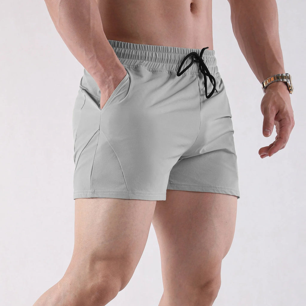 Men's slim fit basketball shorts in grey, black, apricot or green colours with elastic waistband