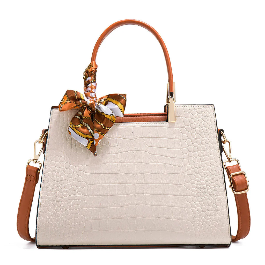 Milky white women's shoulder handbag showing slit pocket and multiple interior compartments