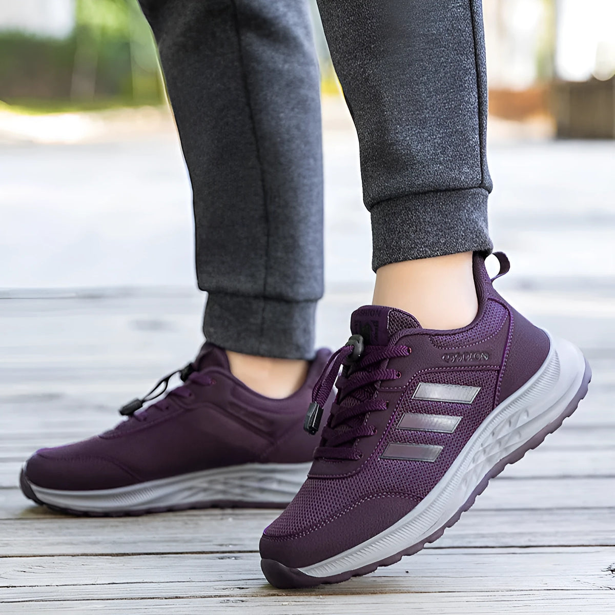 Breathable mesh mom shoes with elastic band and non-slip sole in purple, red, black, and dark grey colours.