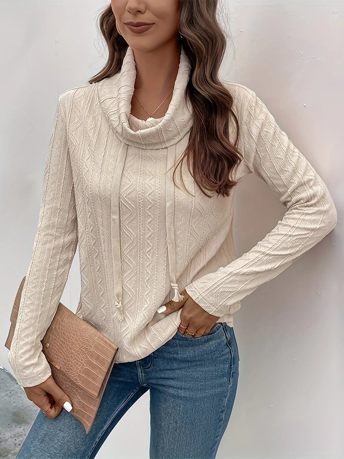 Apricot hooded pullover sweater with drawstring and long sleeves on a mannequin