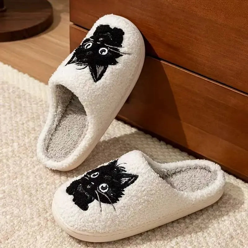 White plush slippers with Black Beard Cat cartoon couple pattern, velvet lining, and a textured non-slip sole.