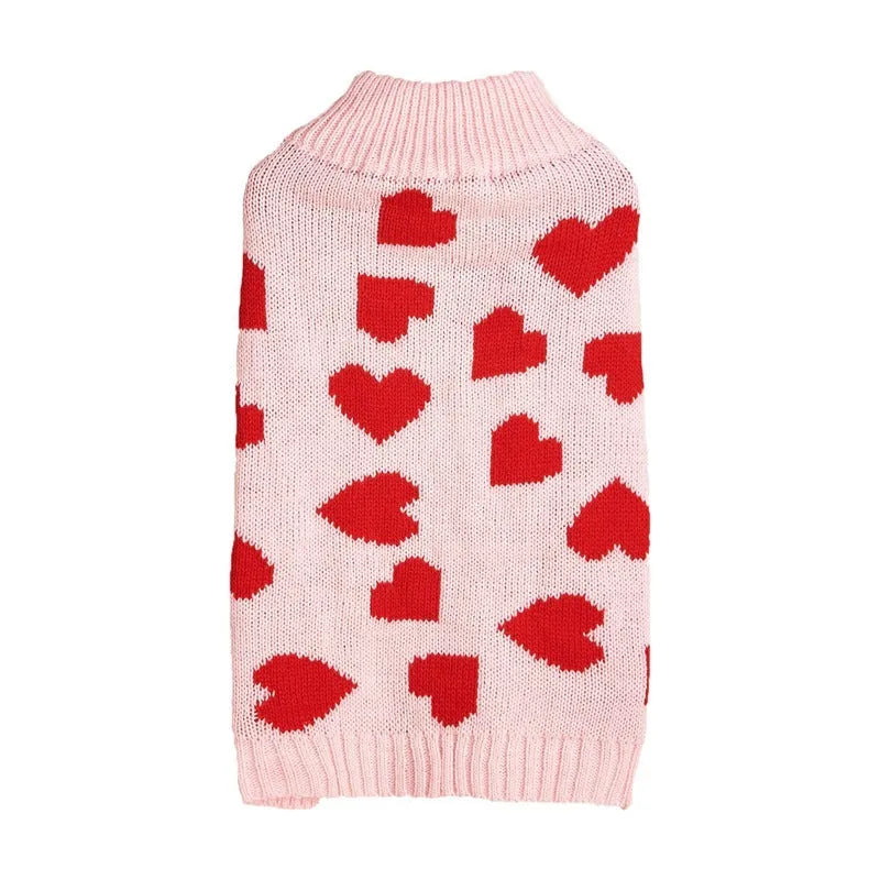 Red dog sweater with love heart design and bow decoration on small dog