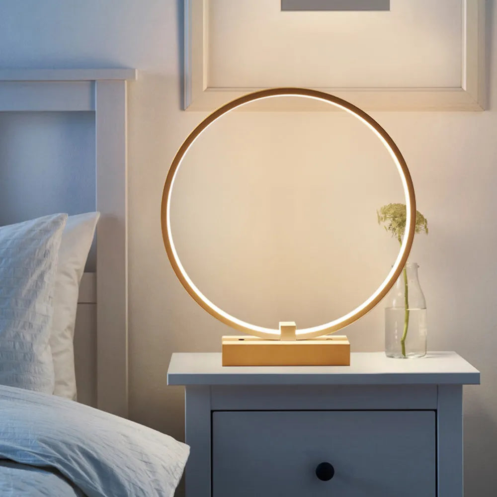 25cm round white LED bedside lamp with acrylic frame and iron base, shown in warm white or cool white