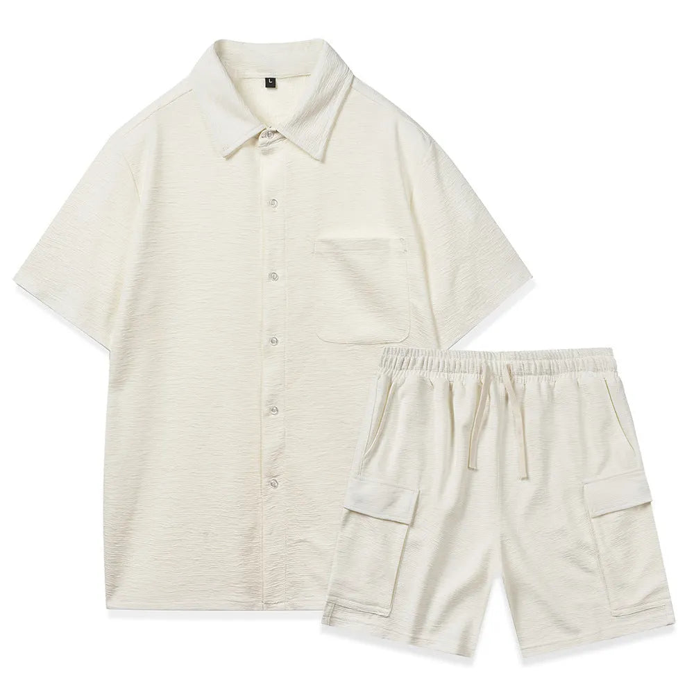 A plain beige two-piece clothing set featuring a short-sleeve top and elastic waist shorts on a hanger.