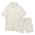 A plain beige two-piece clothing set featuring a short-sleeve top and elastic waist shorts on a hanger.
