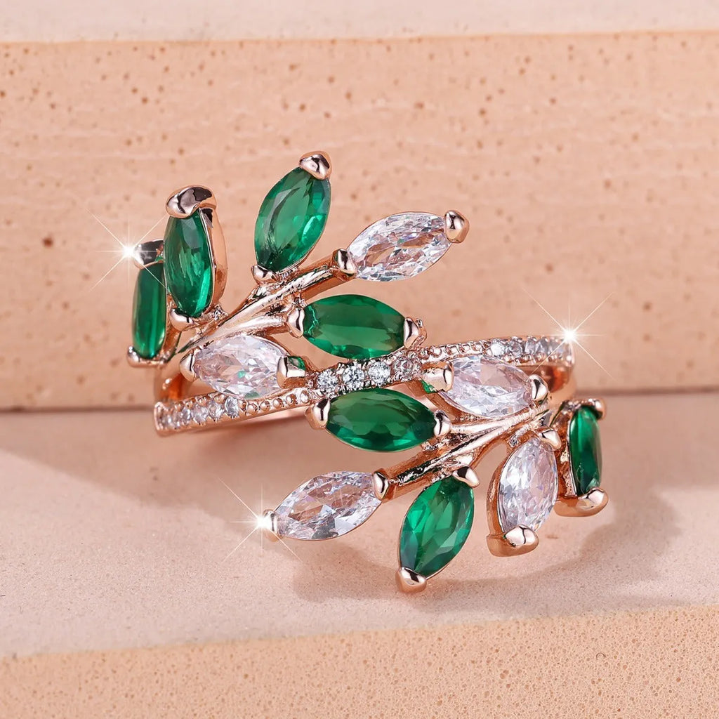 Adjustable horse eye zircon leaf ring in rose gold or platinum plating on a model's hand.
