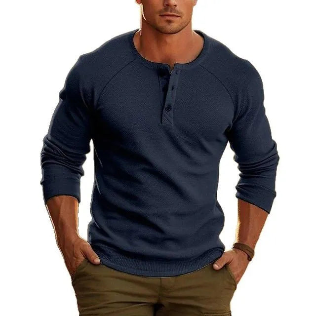 Men's white long-sleeved t-shirt with a Henry collar, laying flat.