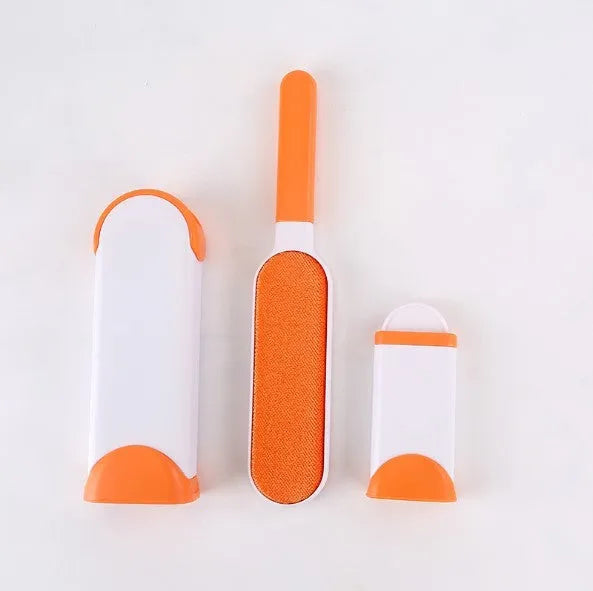 Blue reusable pet hair brush with self-cleaning base for sofas and furniture.