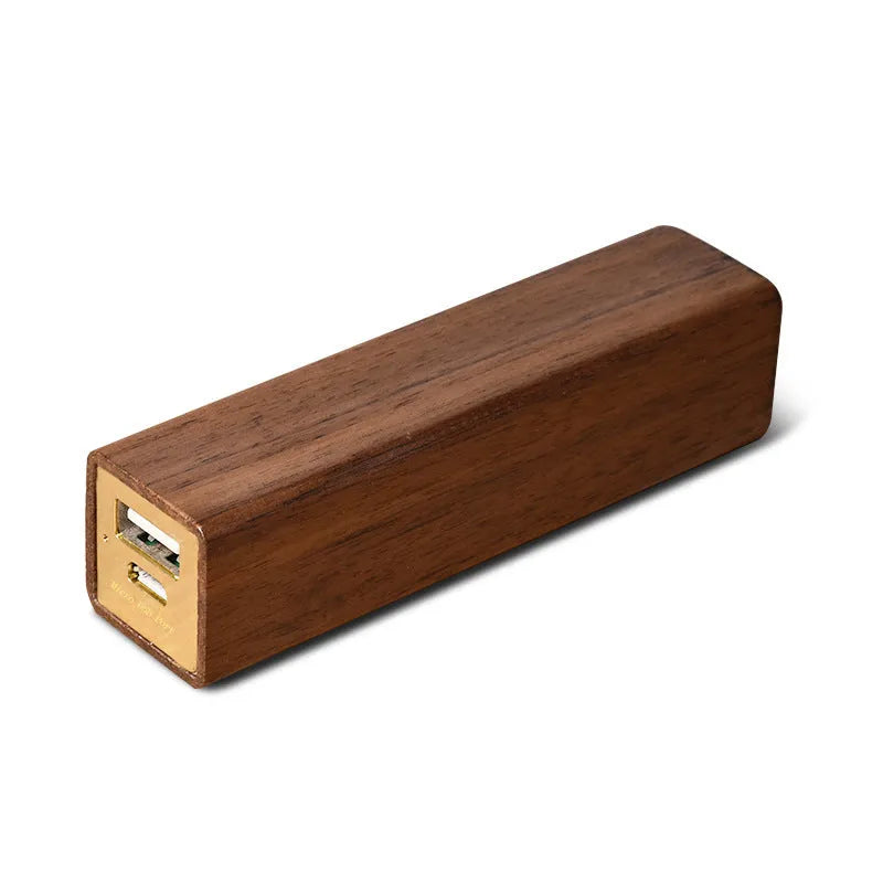 Brown walnut wood portable power bank with USB port showing compact rectangular design.
