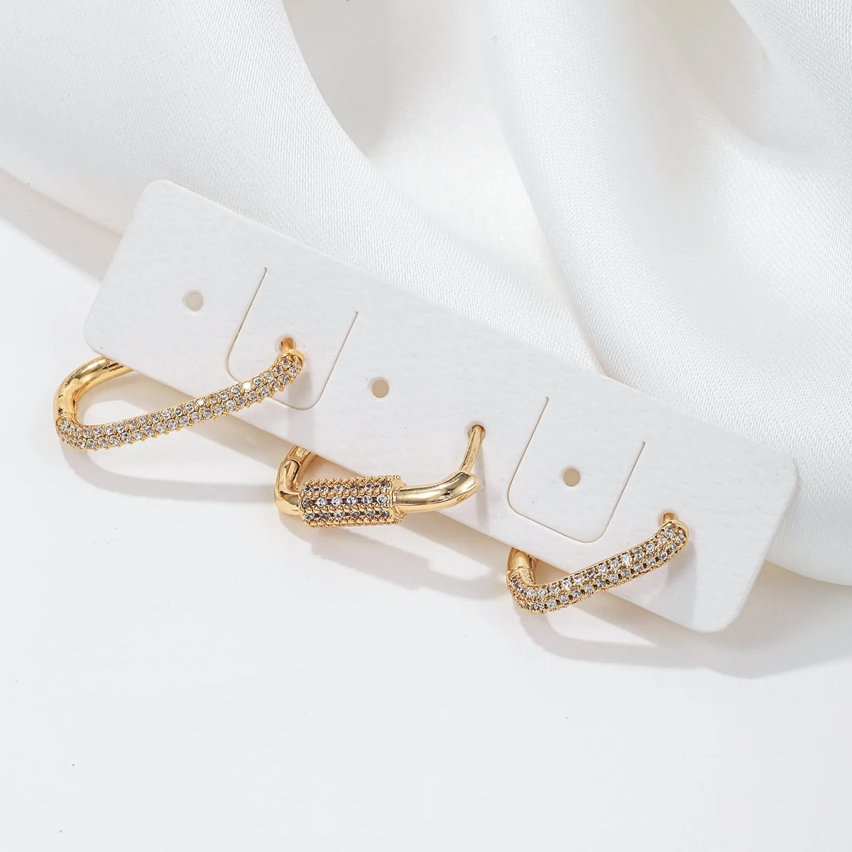 Geometric ear clip set with micro inlaid zircon stones in gold and white finishes