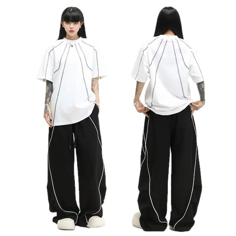 Black pleated wide-leg hip hop pants with striped pattern and mid-waist design made of polyester