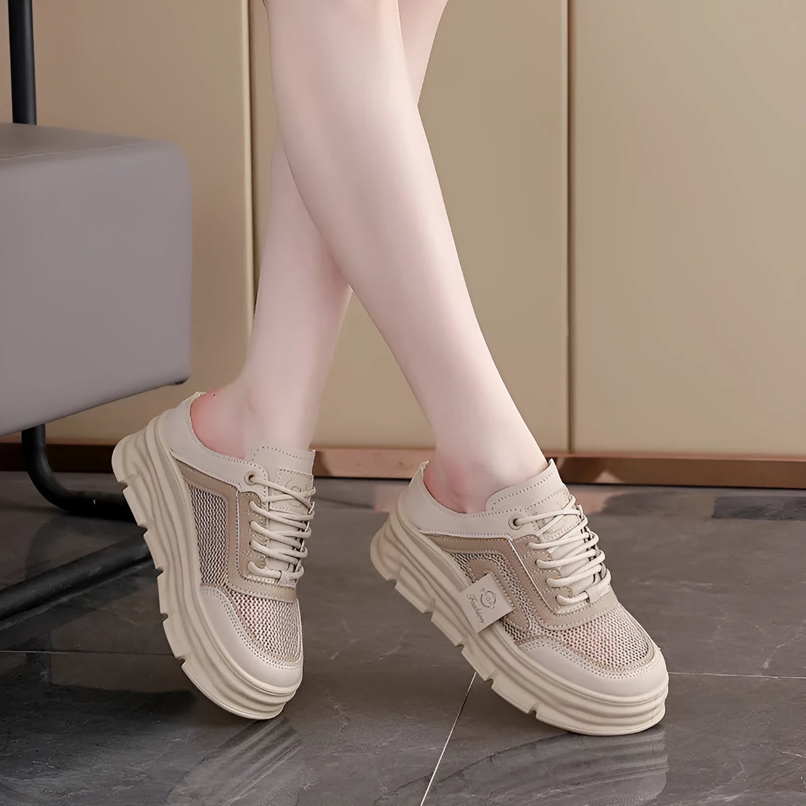 Women's black mesh half slippers with a round toe and rubber sole, shown on a white background.