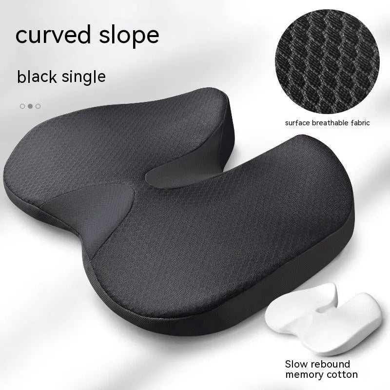 Curved bevel seat cushion for tailbone support in choice of colours on a chair.