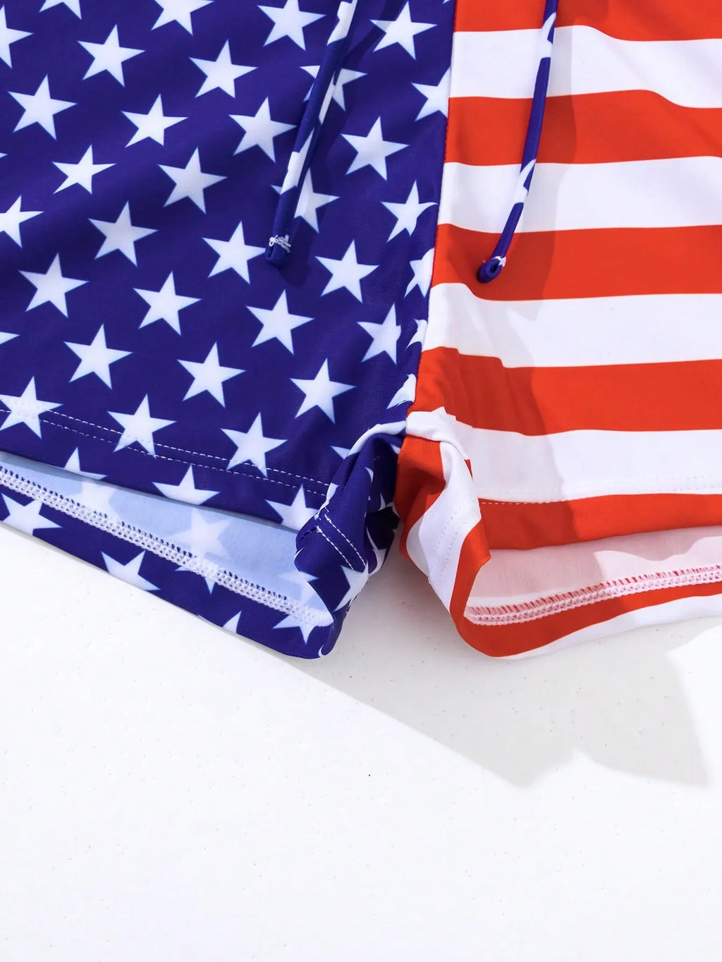 Women's high waist swimsuit with stars and stripes pattern, featuring a drawstring waist and boxer-style briefs