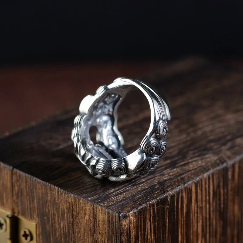 Sterling silver open ring showing animal or zodiac pattern detail with adjustable design
