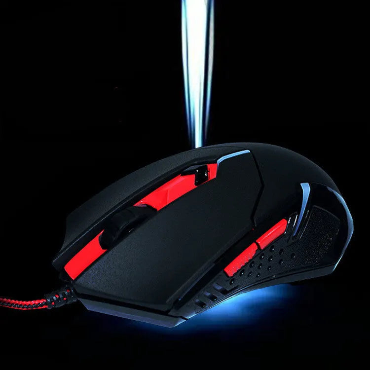 Black and red USB wired gaming mouse with ergonomic shape on a mouse mat.