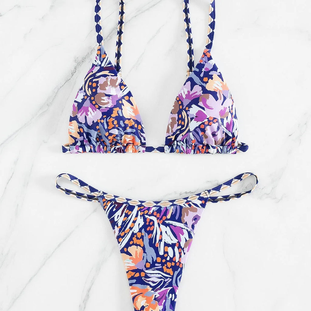 Women's floral print triangle swimsuit with briefs bottom and integrated bag.
