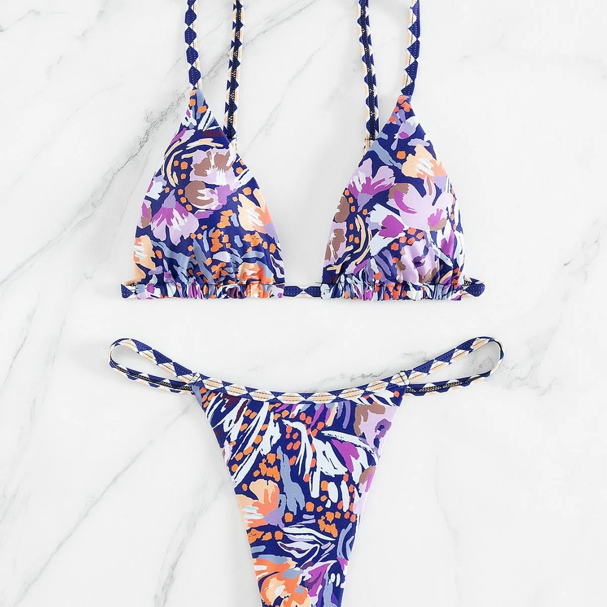 Women's floral print triangle swimsuit with briefs bottom and integrated bag.