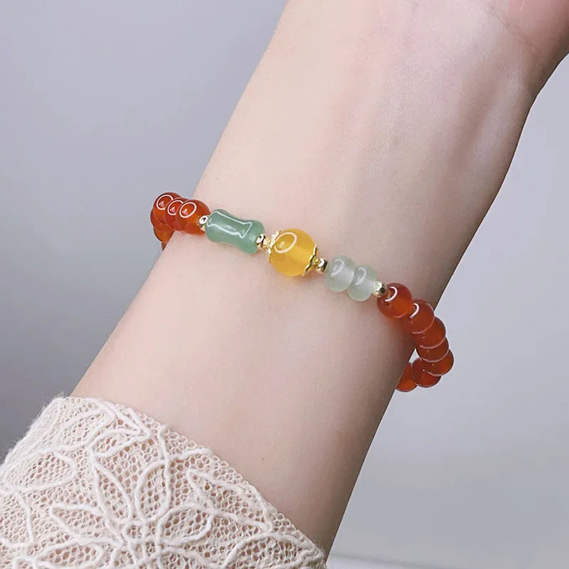 Handmade red agate bracelet with dragon motif for women, Chinese style.