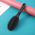 Black and pink ring tooth hair extension comb with airbag cushioning, 22cm length