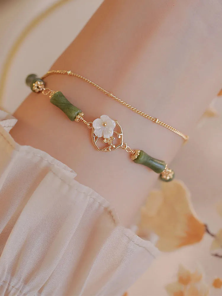 Handmade natural olivine bracelet with double layer twin bells design and olive branch pastoral details