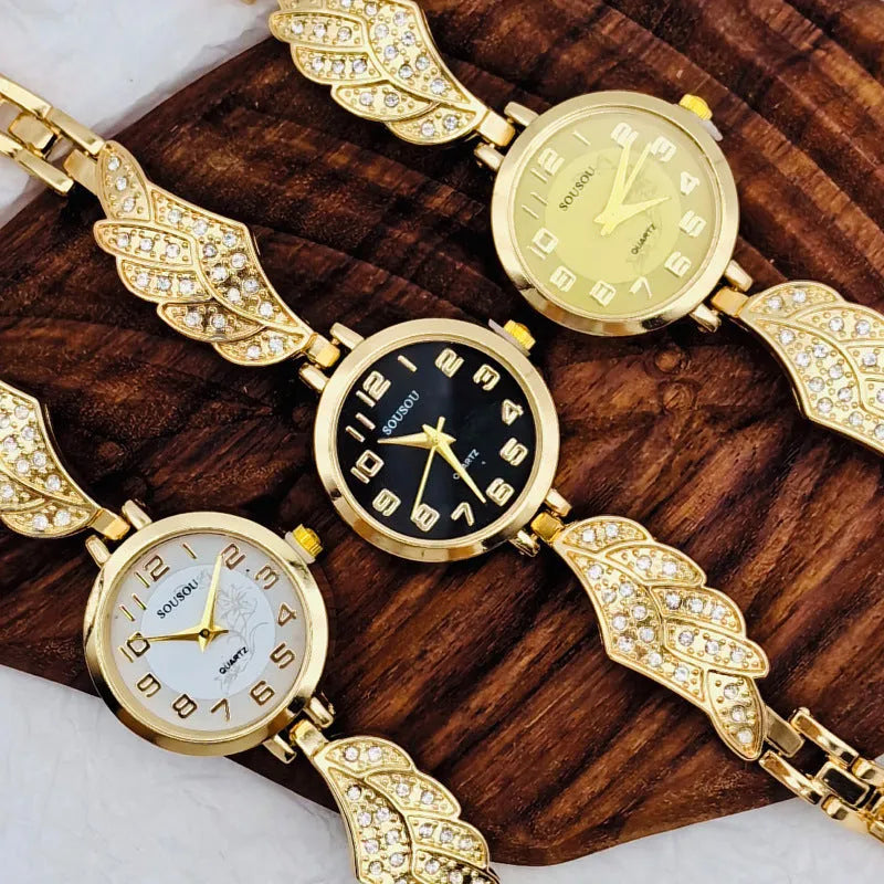 Stainless steel women's watch with round dial and Vachette clasp buckle on wrist.