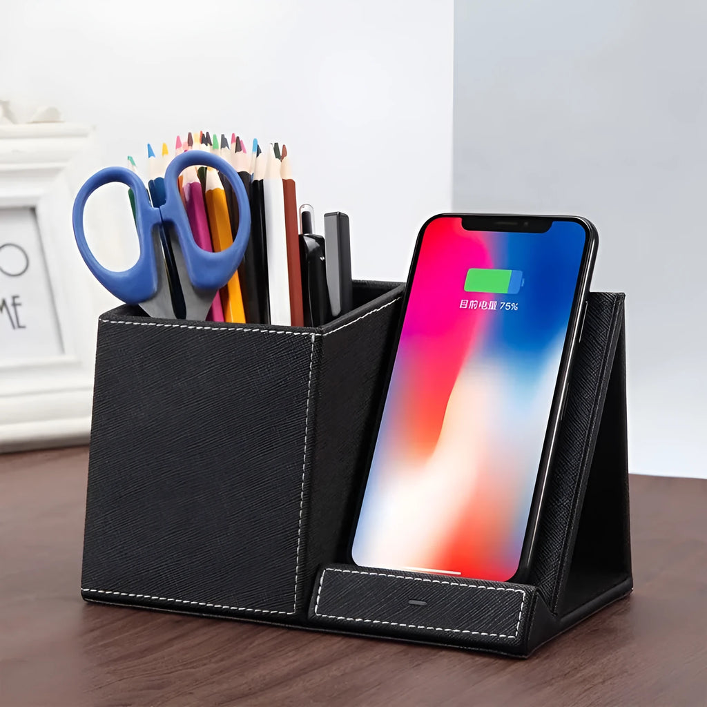 Black leather desk organiser with wireless phone charging pad and pen holder slots.