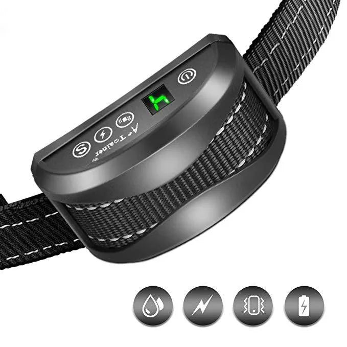 Black digital dog bark training collar with adjustable reflective strap on a table