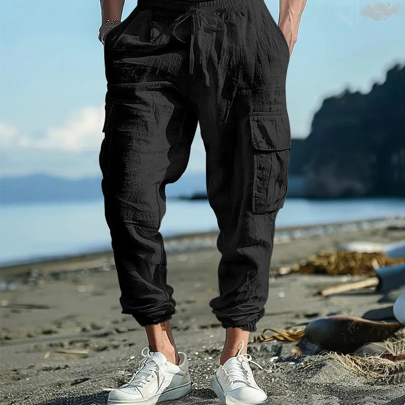 Men's linen cargo trousers with multi-pocket design in army green, black, navy blue, and yellowish brown