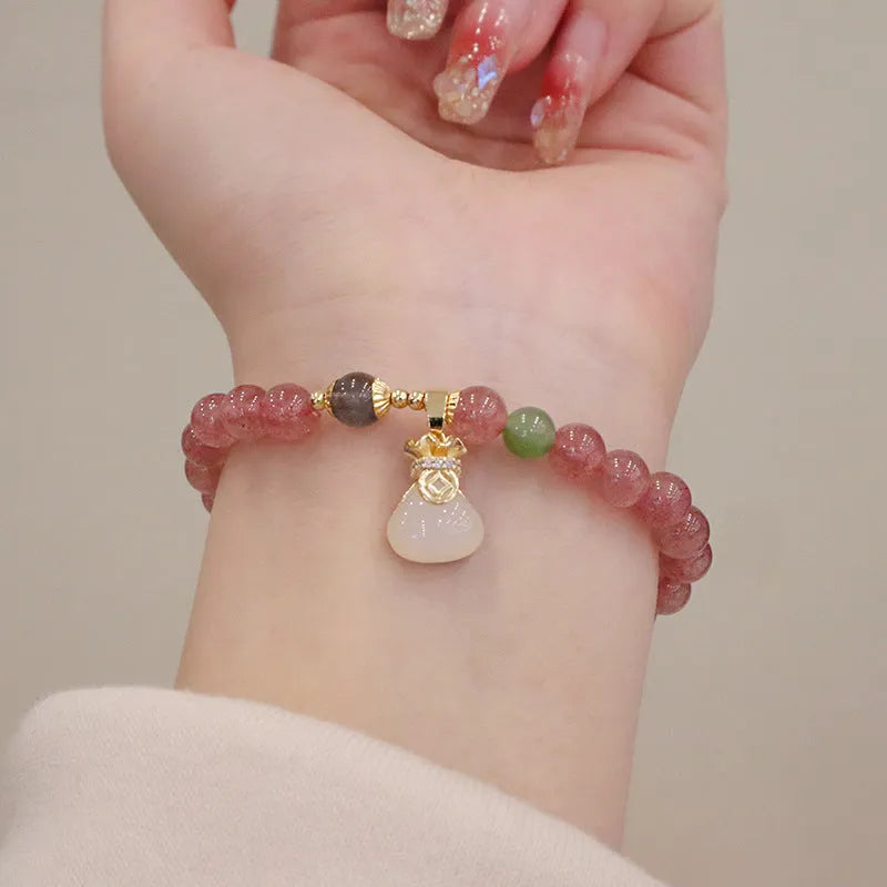 Strawberry quartz bracelet with Chinese purse charm and Hetian jade accents