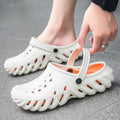 Men's beige EVA slippers with hollow out design and round toe, showing non-slip sole