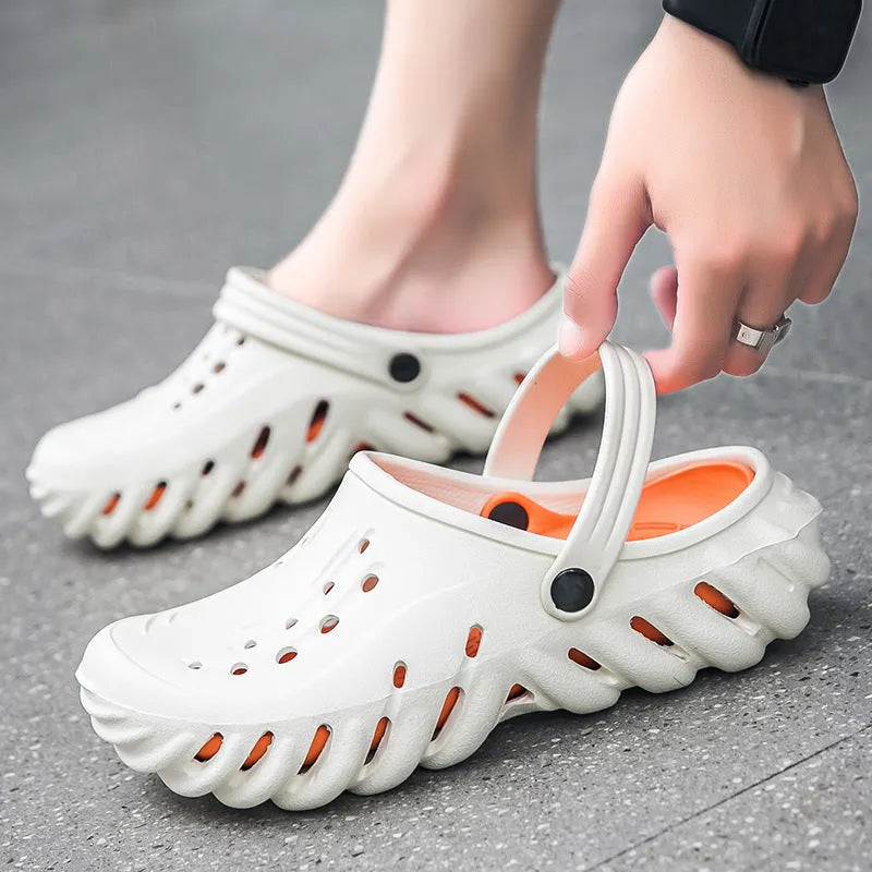Men's beige EVA slippers with hollow out design and round toe, showing non-slip sole