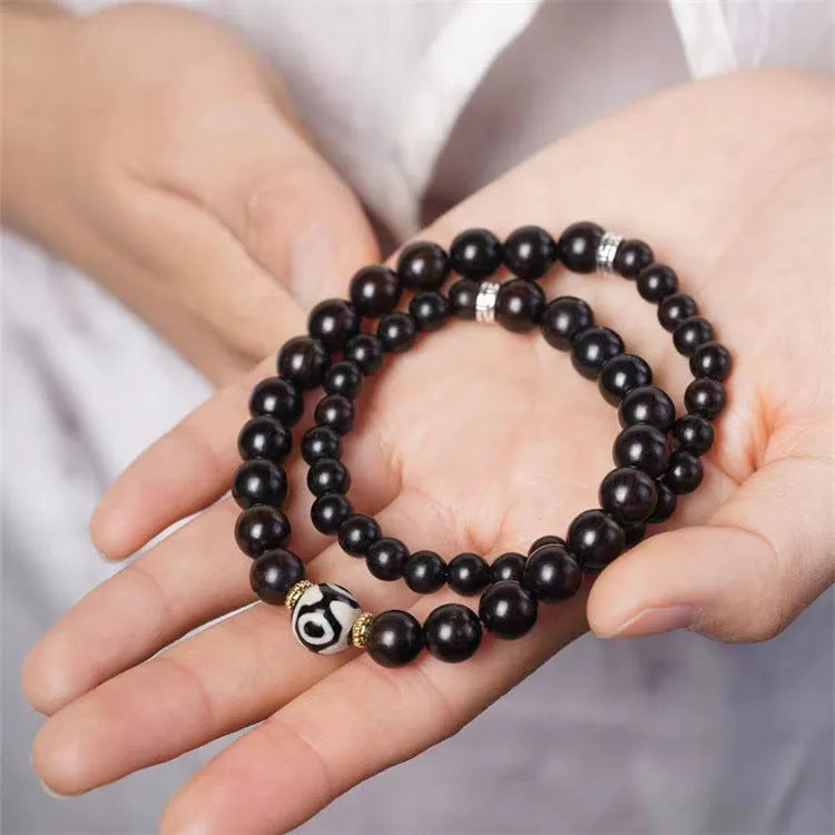 Ebony Tibetan bead bracelet with two circles of 8mm dark wood beads